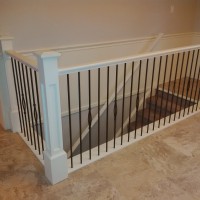 Carpet Grade Stair; Painted Stringer; Colonial Painted Handrail; Wrought Iron Pickets; Painted Box Panel Newel Post